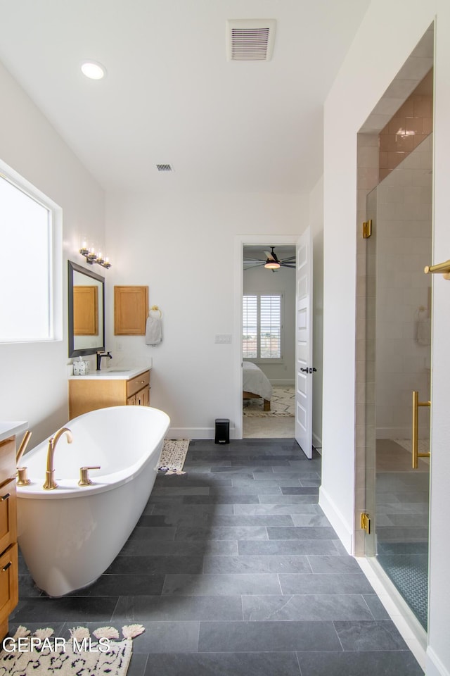 bathroom featuring vanity, ceiling fan, and shower with separate bathtub