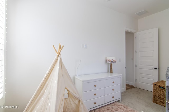 unfurnished bedroom featuring light carpet