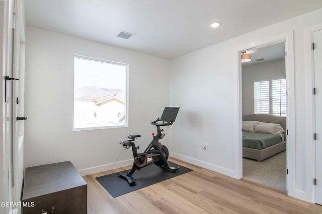 workout area with light wood-type flooring