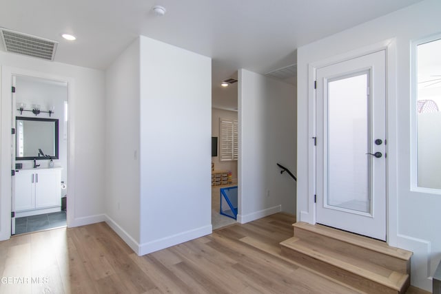 foyer with light hardwood / wood-style floors