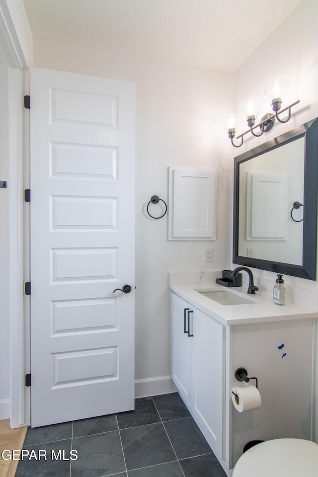 bathroom with tile patterned flooring and vanity