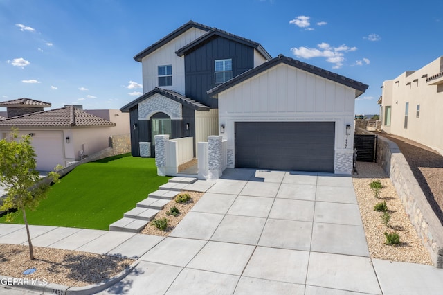 view of front facade with a front yard and a garage