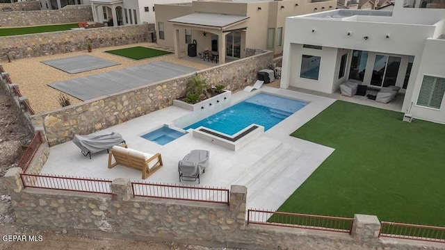 view of pool featuring a patio area and an in ground hot tub