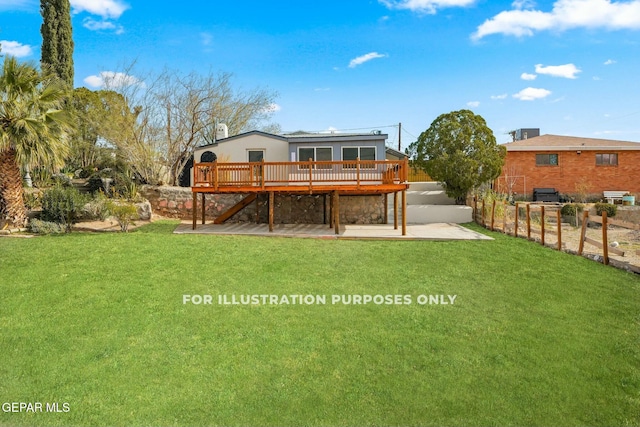 rear view of house with a patio area, a yard, and a deck