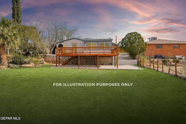 back house at dusk with a wooden deck, a yard, and a patio