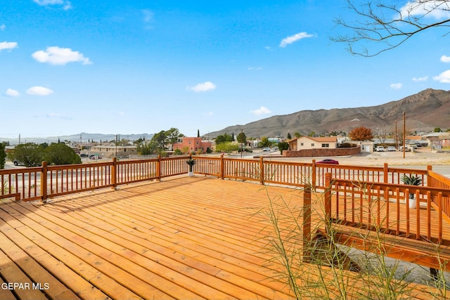 wooden terrace with a mountain view