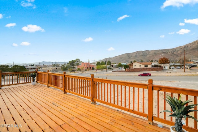 wooden deck featuring a mountain view