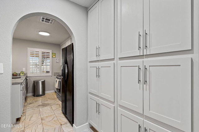 kitchen featuring white cabinetry