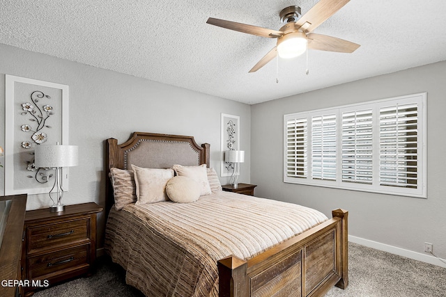 carpeted bedroom featuring ceiling fan and a textured ceiling