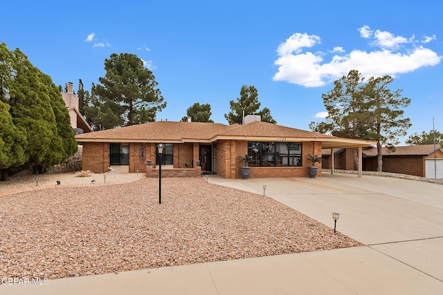 ranch-style house with a carport