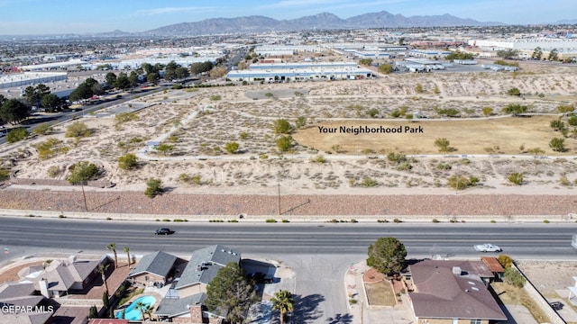 drone / aerial view featuring a mountain view