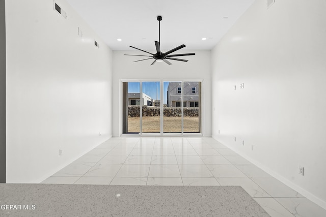 spare room featuring ceiling fan