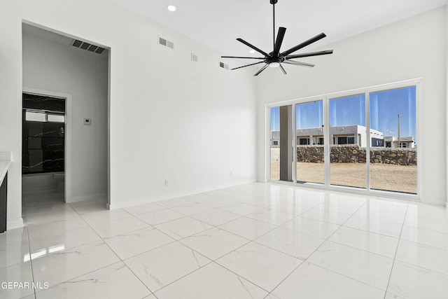 unfurnished room with ceiling fan