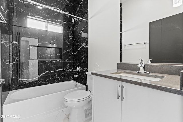 full bathroom with vanity, tiled shower / bath combo, and toilet