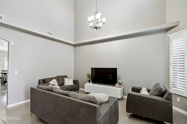 7828 Enchanted View Dr, El Paso, TX 79911 - living area with a towering ceiling, a chandelier, light tile patterned floors, and arched walkways