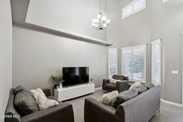 7828 Enchanted View Dr, El Paso, TX 79911 - living room with light tile patterned flooring, a towering ceiling, and a chandelier
