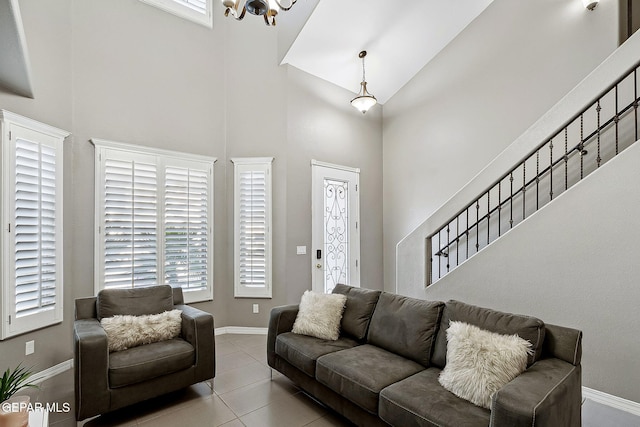 7828 Enchanted View Dr, El Paso, TX 79911 - living area with high vaulted ceiling, a chandelier, and tile patterned flooring