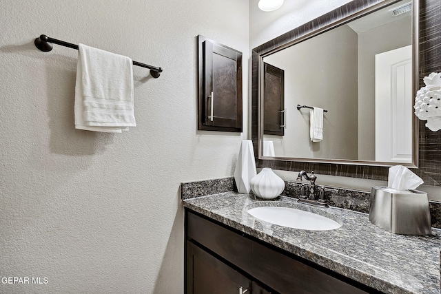 7828 Enchanted View Dr, El Paso, TX 79911 - bathroom featuring vanity and a textured wall