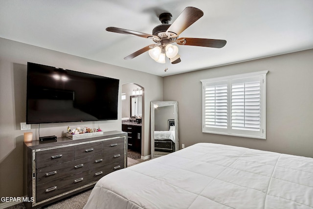 bedroom with connected bathroom and ceiling fan