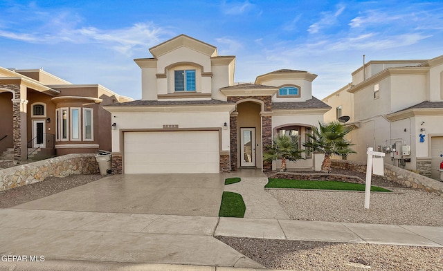 mediterranean / spanish-style home featuring a garage