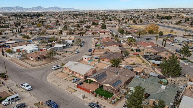 birds eye view of property with a mountain view