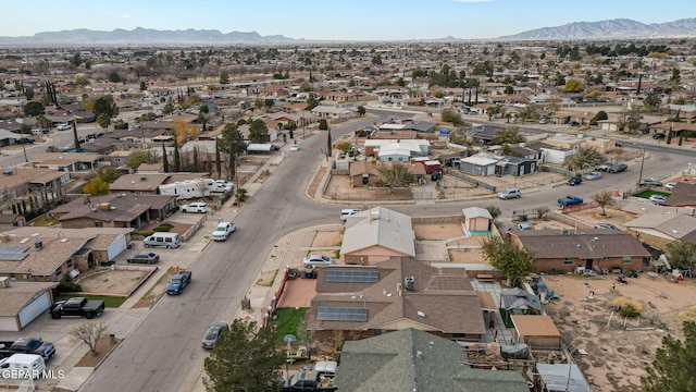 birds eye view of property with a mountain view