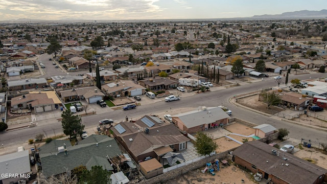 birds eye view of property featuring a mountain view