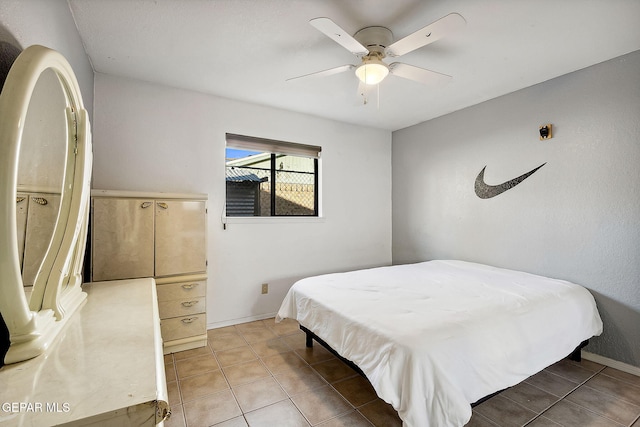 bedroom with tile patterned floors and ceiling fan