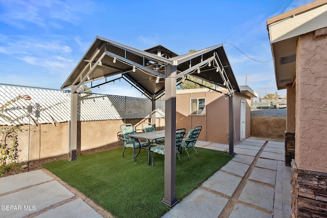 view of yard featuring a gazebo and a patio area