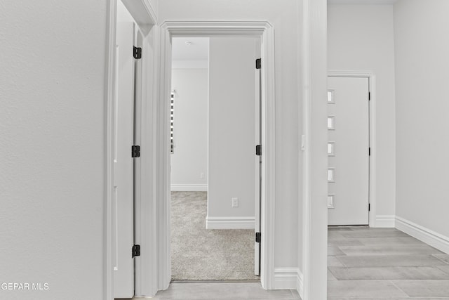 corridor featuring light hardwood / wood-style floors