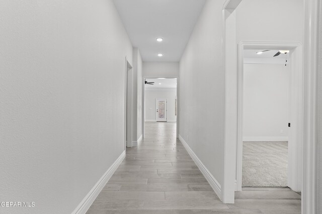 corridor featuring light hardwood / wood-style flooring