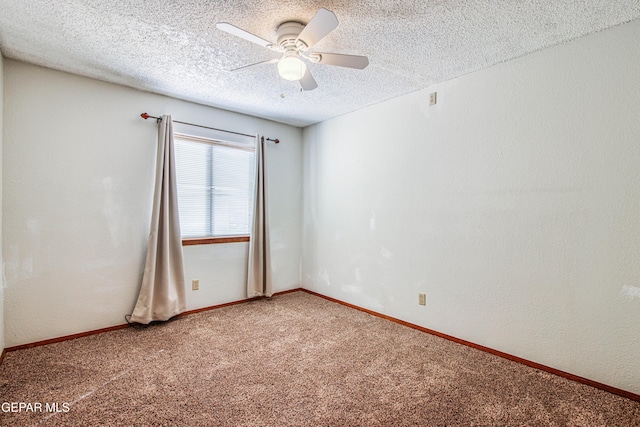 carpeted empty room featuring ceiling fan and a textured ceiling