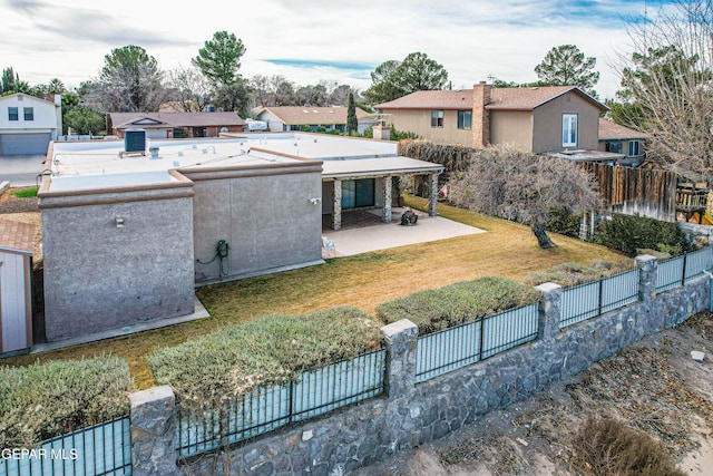 view of front facade featuring a front yard and a patio area