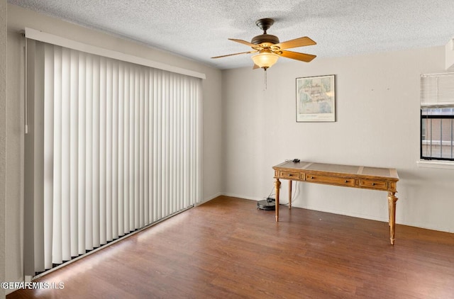 miscellaneous room with hardwood / wood-style floors, a textured ceiling, and ceiling fan