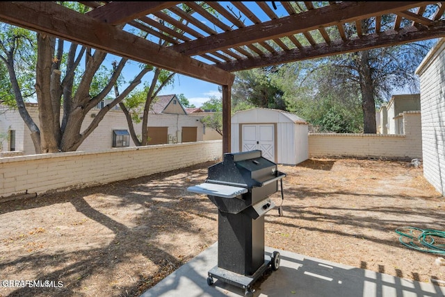 exterior space featuring a pergola, a shed, and grilling area