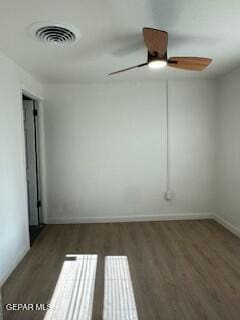 spare room featuring hardwood / wood-style floors