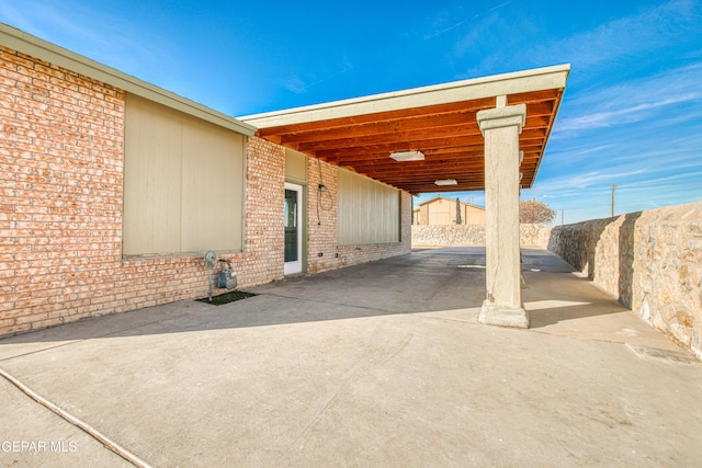 view of patio / terrace featuring a carport