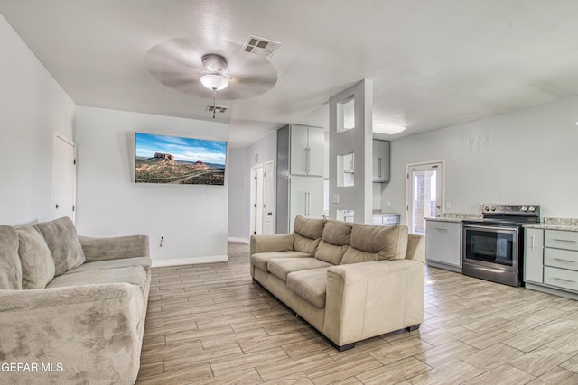 living room featuring ceiling fan