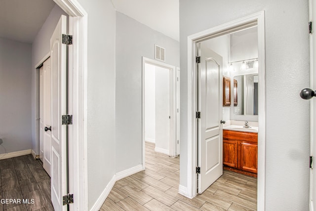 hallway featuring sink