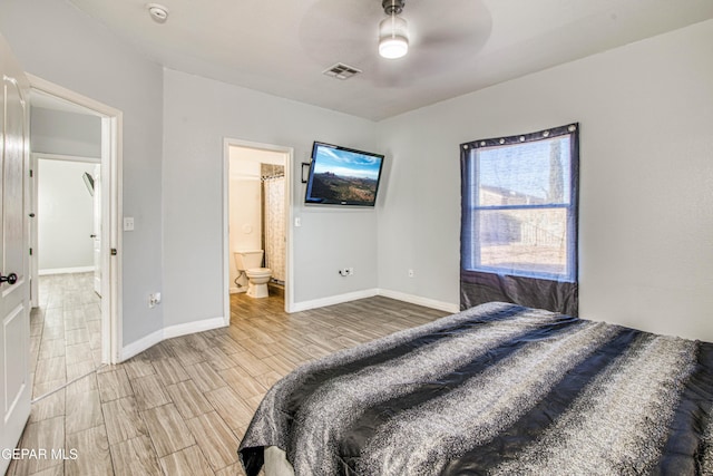 bedroom featuring ensuite bath and ceiling fan