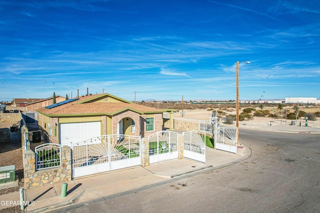 view of front of property with a garage