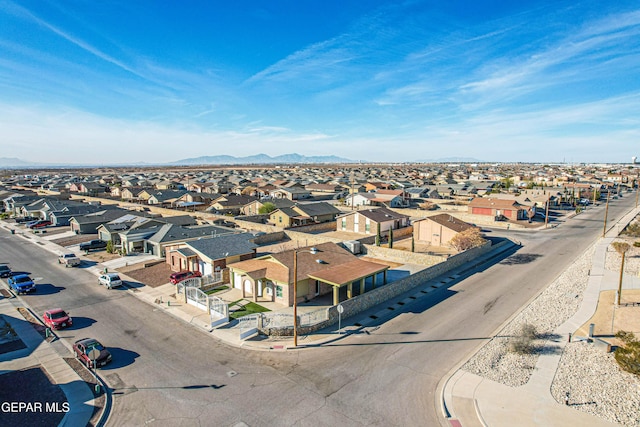 birds eye view of property with a mountain view