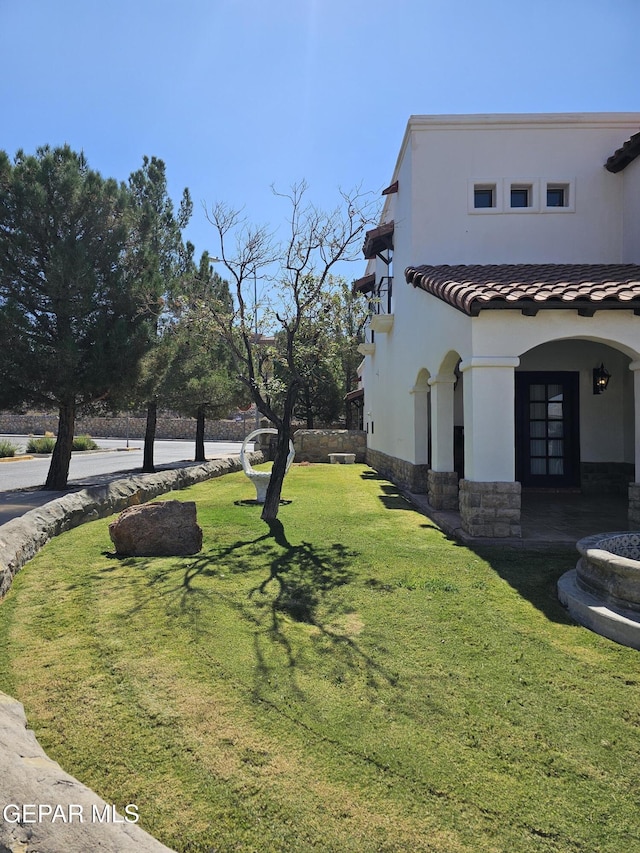 view of home's exterior with a lawn