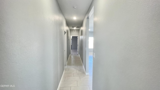 hallway with light tile patterned floors