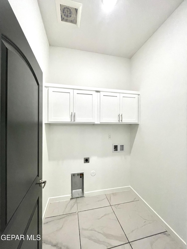 laundry area with washer hookup, cabinets, gas dryer hookup, and electric dryer hookup