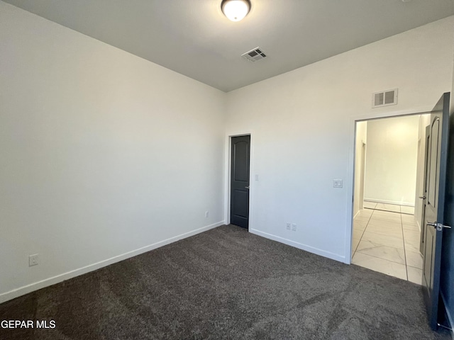 unfurnished bedroom featuring light colored carpet