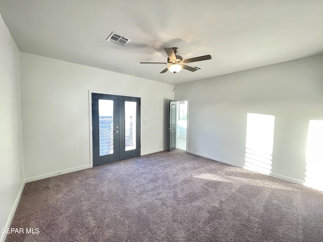 spare room featuring ceiling fan, french doors, and carpet flooring