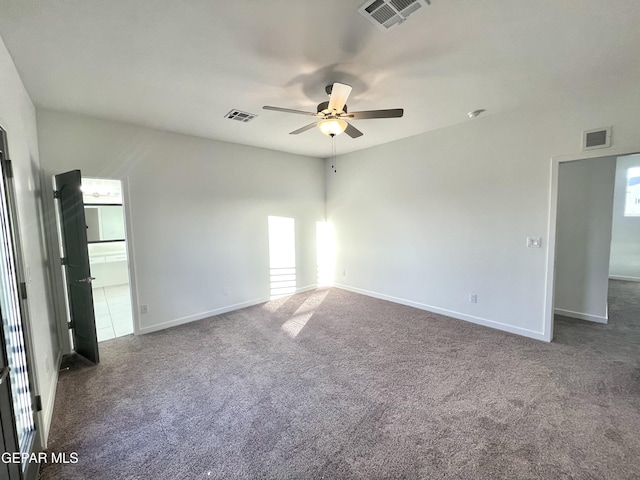 carpeted spare room with ceiling fan