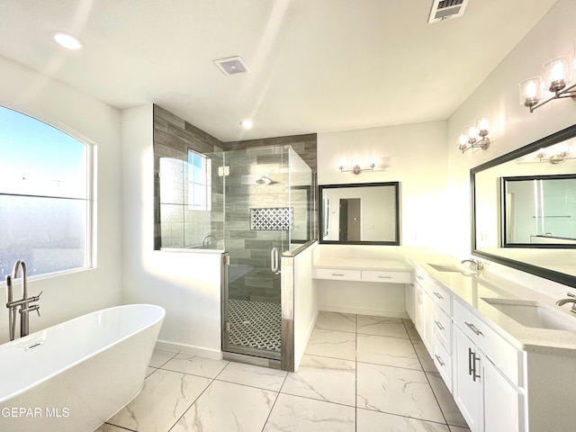 bathroom featuring shower with separate bathtub and vanity