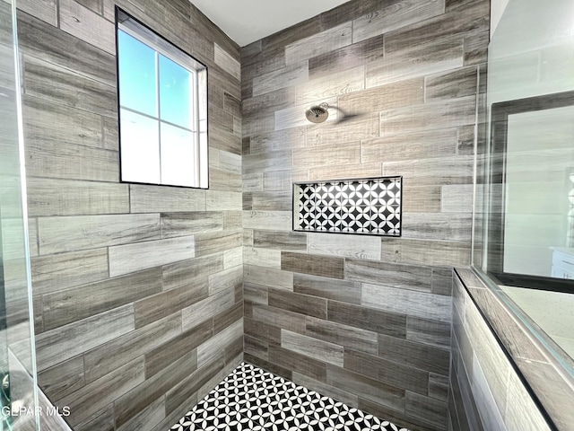 bathroom with tiled shower